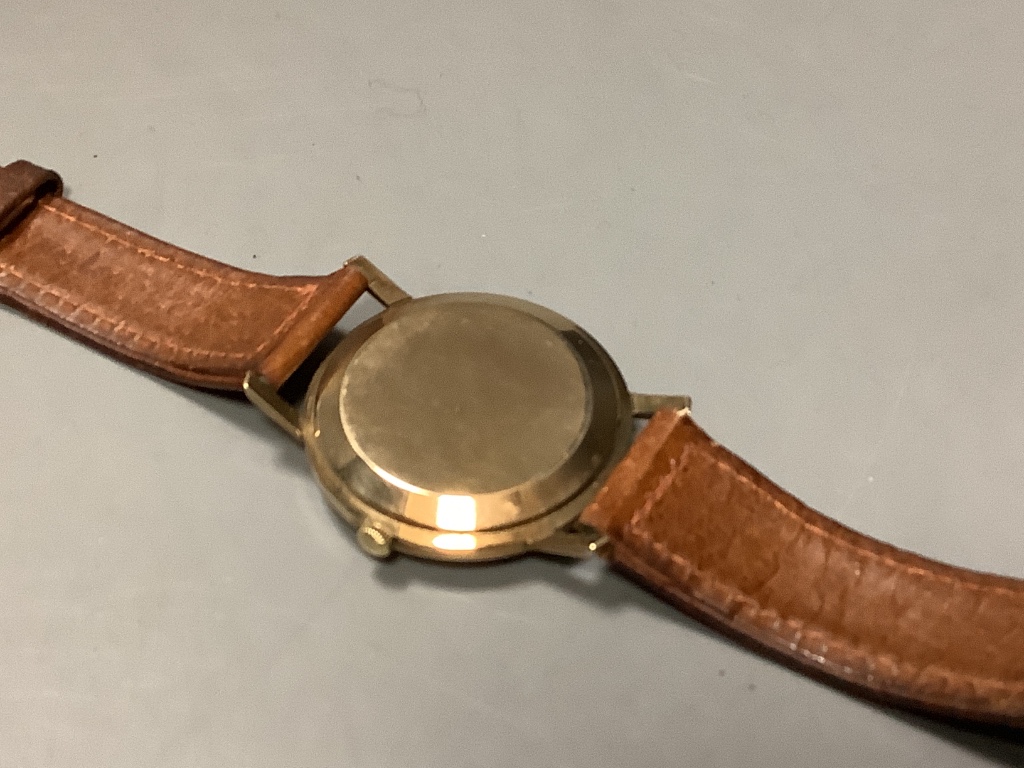 A gentleman's 9ct gold Longines Flagship automatic wristwatch, on a leather strap, with Longines box, case diameter 36mm, excluding crown, gross 36.8 grams.